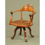 A late 19th century mahogany office or desk chair, in the Arts and Crafts style,