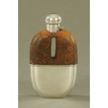 A silver plated hip flask, with reptile skin cover.
