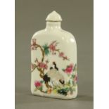 A Chinese opium bottle, polychrome decorated with birds, blossom and branches. Height 9 cm.
