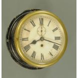 A brass and painted metal cased ships bulkhead clock, by W M Elliott Ltd. Overall diameter 25.5 cm.