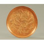 A W H Mawson of Keswick copper leaf design charger, stamped W H Mawson Keswick. Diameter 29.5 cm.