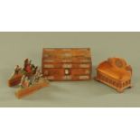A Victorian rosewood inlaid mother of pearl table box, and two pairs of Folk Art bookends.