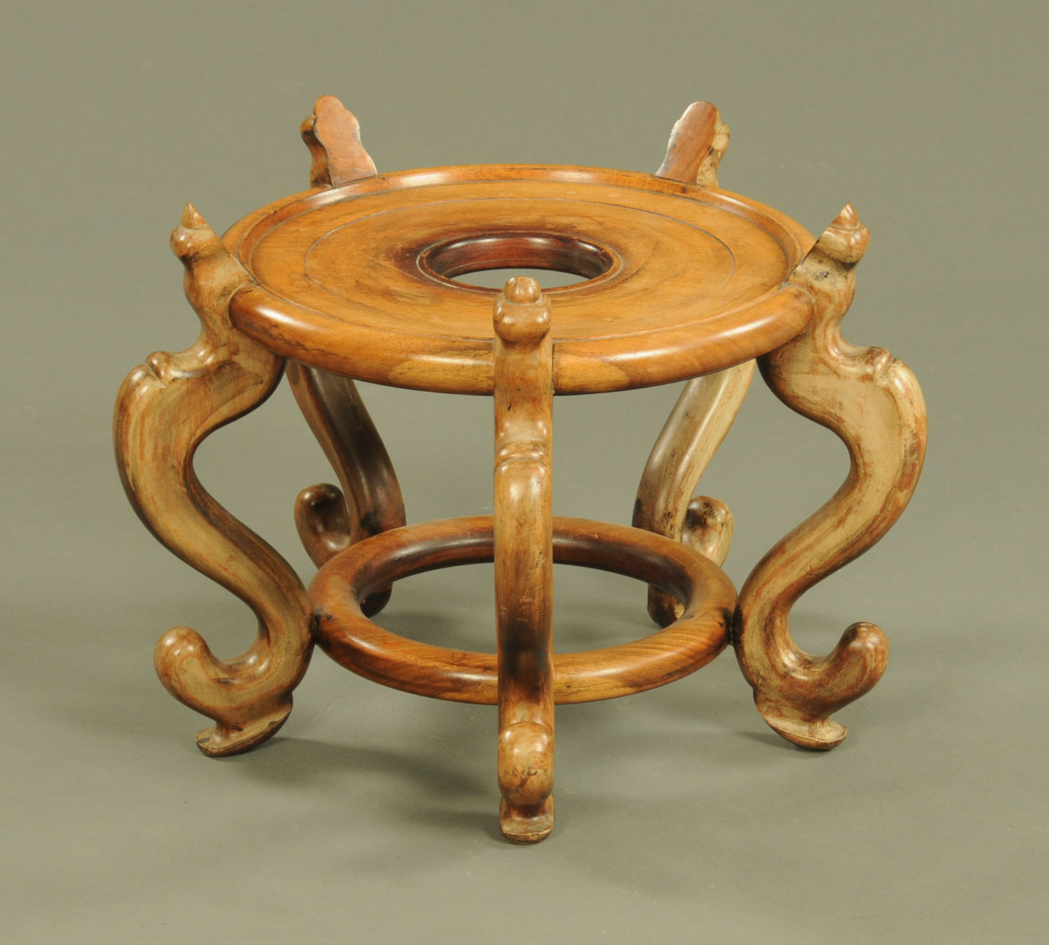 A Chinese hardwood jardiniere stand, top diameter 42 cm, height 40 cm.