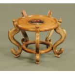 A Chinese hardwood jardiniere stand, top diameter 42 cm, height 40 cm.
