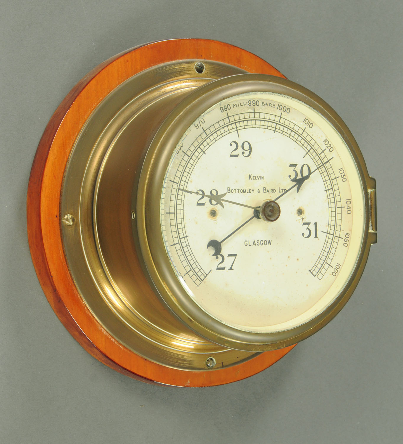 A Kelvin Bottomley and Baird Limited of Glasgow brass ships bulkhead style barometer,