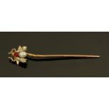 A gold coloured metal stick pin with insect terminal set with diamonds,