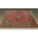 A large Persian design rug, with centre rectangular panel with multiple line border,