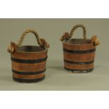 A pair of rope handled metal bound barrel form buckets. Height 34 cm, diameter 31 cm.