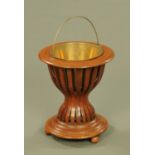 An Edwardian inlaid mahogany jardiniere stand, with removable liner,