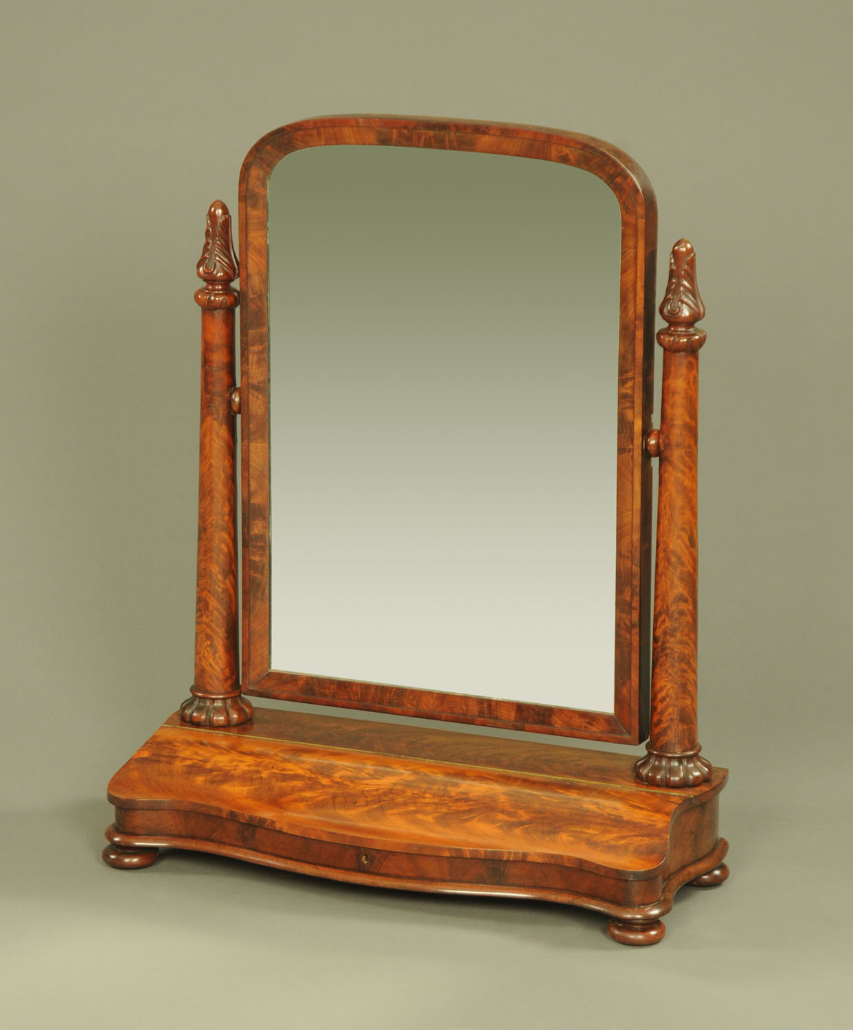 A large Victorian mahogany toilet mirror, with carved capitals, inverted tapering columns,