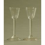 A pair of late 18th century stem glasses, each with ogee bowl and folded circular foot. Height 15.