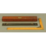 An antique mahogany cased rolling parallel rule by Stanley,