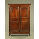An early 19th century French walnut armoire,