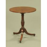 A Regency mahogany tripod table, with circular fixed top,