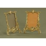 A pair of embossed brass photograph frames, in the Rococo style. Height 23 cm, width 16.5 cm.