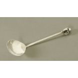 A George V planished silver sauce ladle,