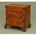 A walnut chest of drawers,