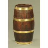 An oak barrel form brass bound stick stand. Height 60 cm, width across top 27 cm.