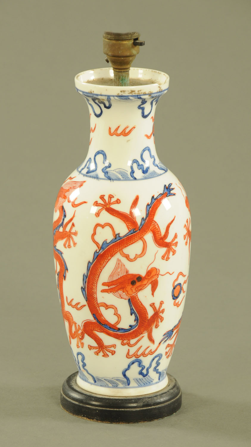 A Chinese vase, converted to a table lamp, decorated with dragons.