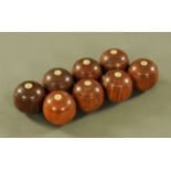 A set of hardwood carpet bowls. Each diameter +/- 6 cm.