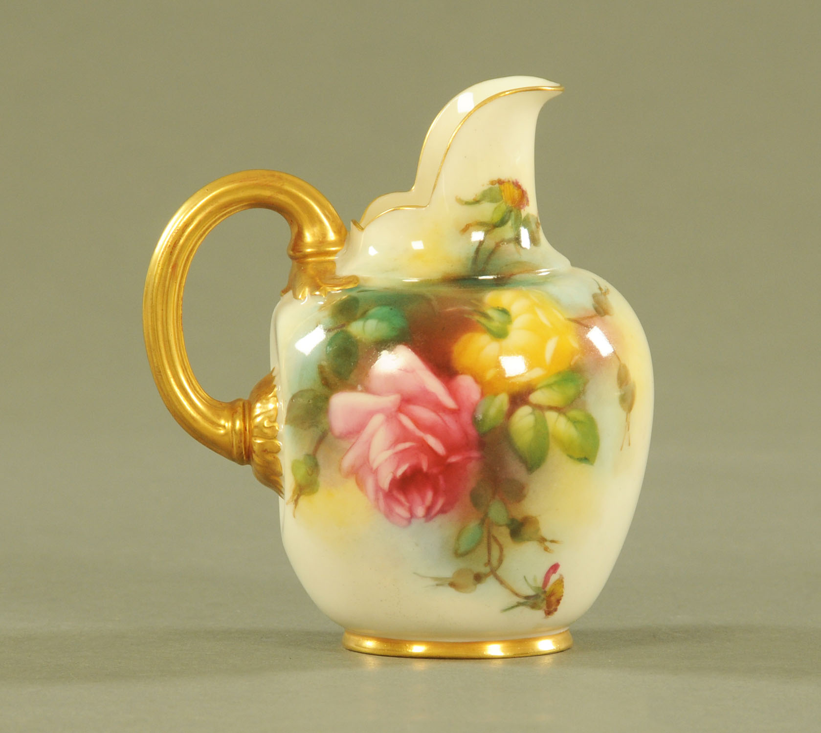 A Royal Worcester flat back jug, 1094, painted with roses and heightened with gilding, puce mark.