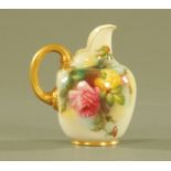 A Royal Worcester flat back jug, 1094, painted with roses and heightened with gilding, puce mark.