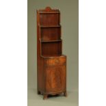 A mahogany narrow shelf unit and combined bowfronted cupboard, raised on splayed bracket feet.