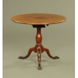 A George III mahogany tripod table, with snap action,