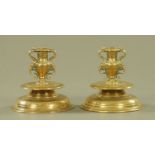 A pair of antique bronze, possibly Italian or Eastern candlesticks. Height 15 cm, diameter 15.5 cm.