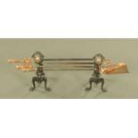 A pair of 19th century fire dogs, and a set of fire irons.