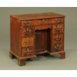 A Georgian mahogany kneehole desk, with long drawer, kneehole, cupboard,