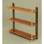 A Regency rosewood three tier open shelf unit,