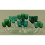 A set of six green tinted wine glasses, and 13 similar glasses, tallest 14 cm.