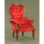 A Victorian mahogany framed gentleman's armchair, with deep buttoned back,