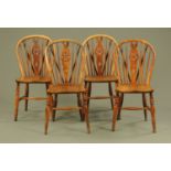 A set of four late Victorian Windsor wheel back dining chairs.