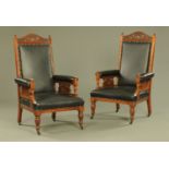 A pair of late Victorian walnut black leather upholstered library armchairs,