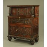 An antique oak court cupboard, in two sections,
