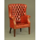 A George III style leather upholstered club armchair,
