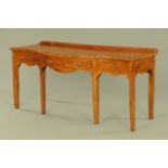 A George III mahogany serving table, of serpentine outline,