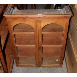 A 19th century pine glazed bookcase. Wal