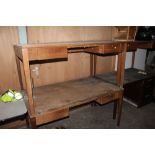 A Vintage oak desk with laminate writing