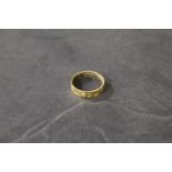 A 9 ct gold wedding bank with engraved d