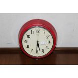 A vintage Metamec electric clock in red