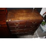 A Georgian oak and mahogany chest of 2/3