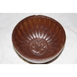 A 20th century brown glazed stoneware li