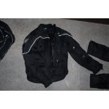 An R K Sports XL motorcycle jacket.