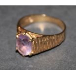 A 9 ct gold and amethyst ring with textu