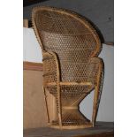 A woven wicker butterfly chair.