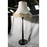 A 20th century oak table lamp of turned