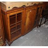 A reproduction inlaid mahogany bookcase,